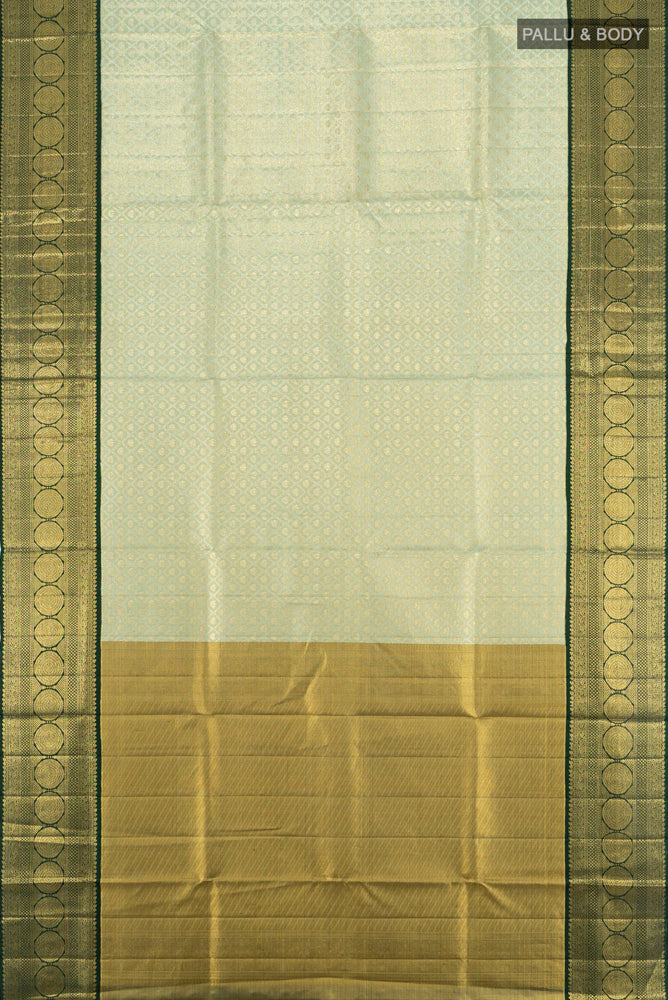 Flat view of Pista Green Kanjivaram Silk Saree with Zari Butta on the body and Silk Border. 