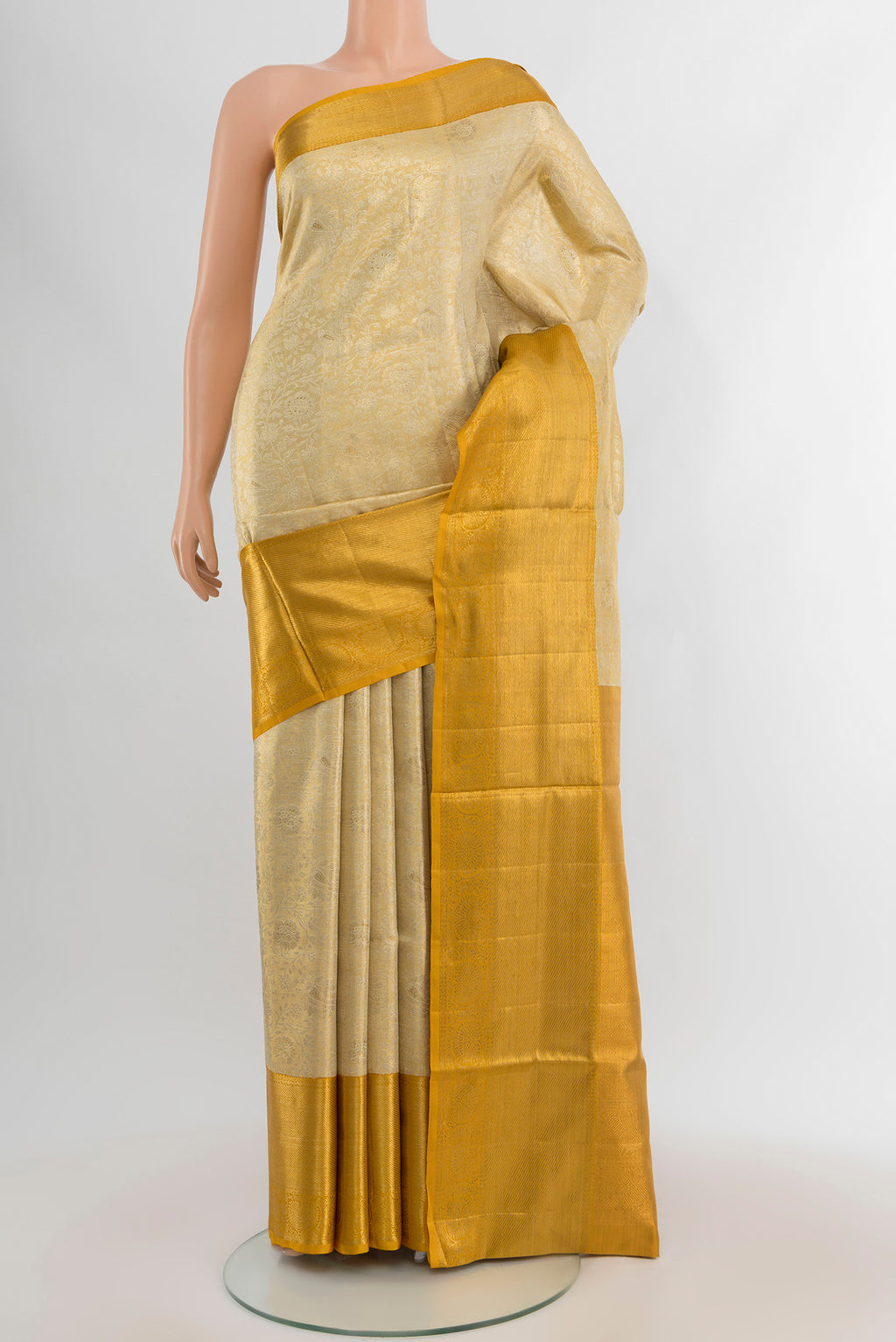 Golden Kanjivaram Tissue Silk Saree with Zari Brocade on the body and Zari Border.  displayed on a mannequin
