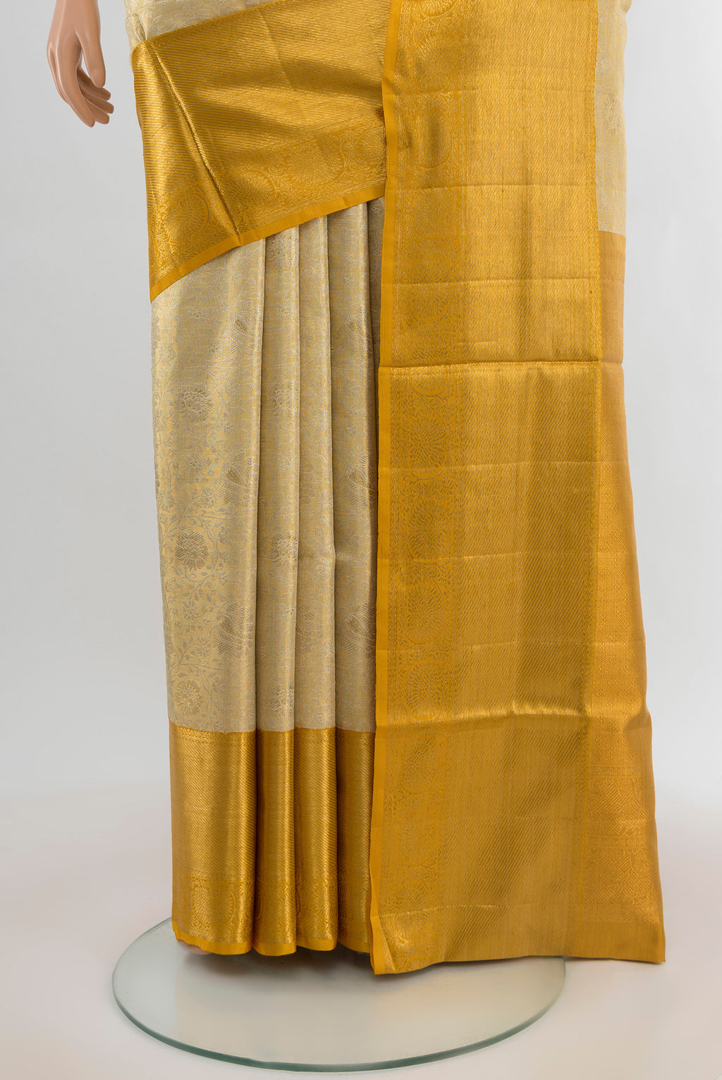 Pleats and pallu of Golden Kanjivaram Tissue Silk Saree with Zari Brocade on the body and Zari Border. 