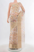 Cream Tussar Silk Saree with Floral Print on the body and Silk Border.  displayed on a mannequin