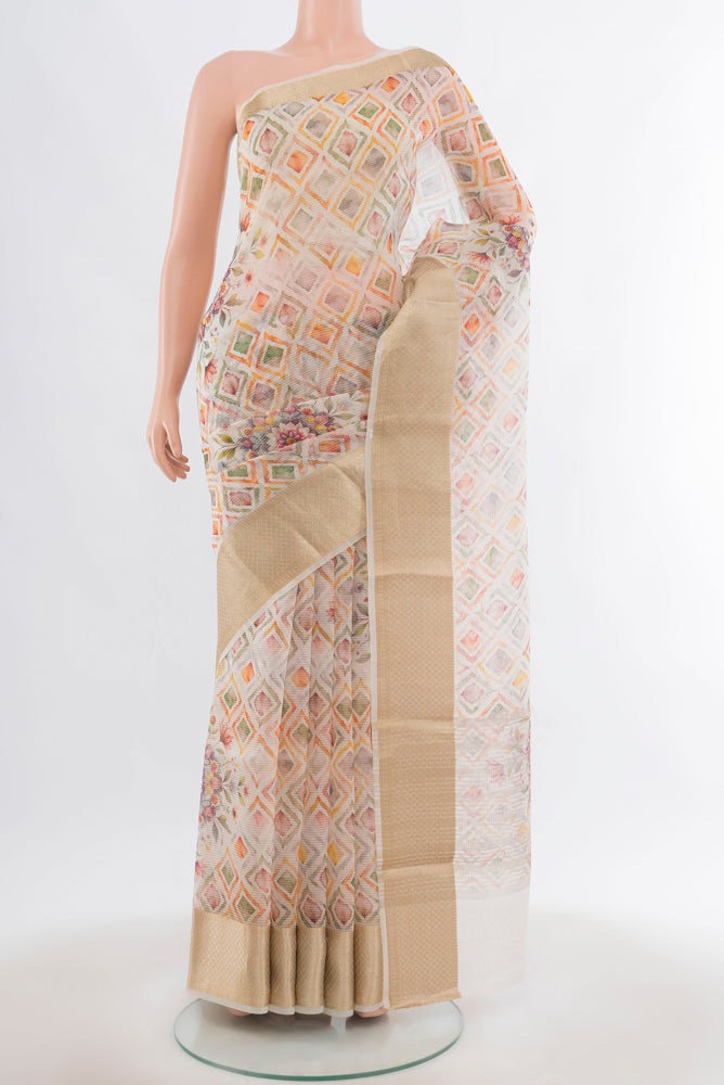 Cream Tussar Silk Saree with Floral Print on the body and Silk Border.  displayed on a mannequin