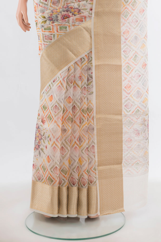 Pleats and pallu of Cream Tussar Silk Saree with Floral Print on the body and Silk Border. 