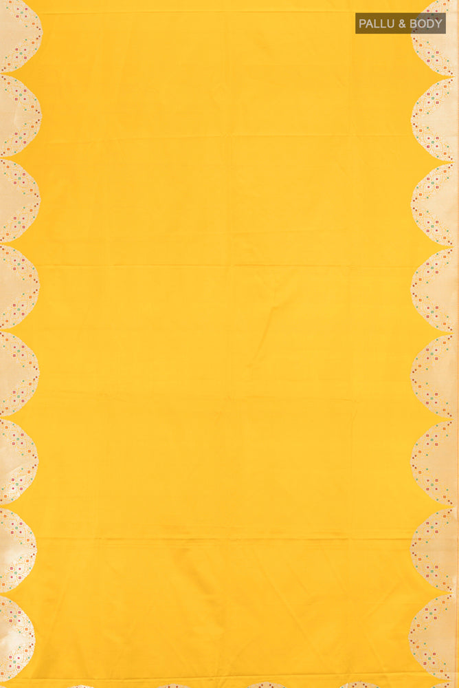 Flat view of Pure Silk Pure Zari Lemon Yellow Banarasi Saree with Zari Butta on the body and Silk Border. 