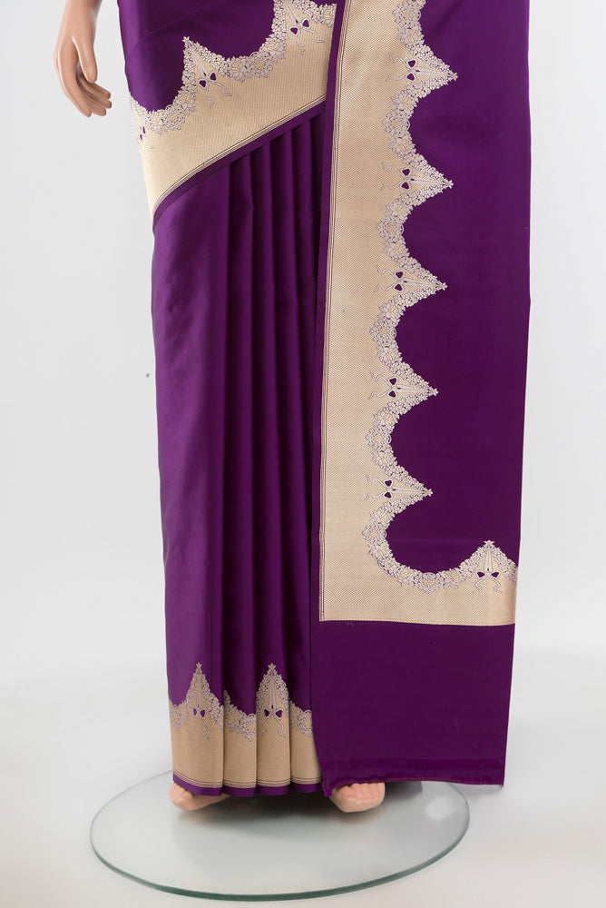 Pleats and pallu of Pure Silk Pure Zari Violet Banarasi Saree with Zari Butta on the body and Silk Border. 