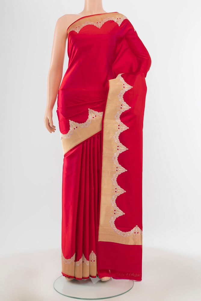 Dark Pink Banarasi Katan Silk Saree with Zari Butta on the body and Silk Border.  displayed on a mannequin