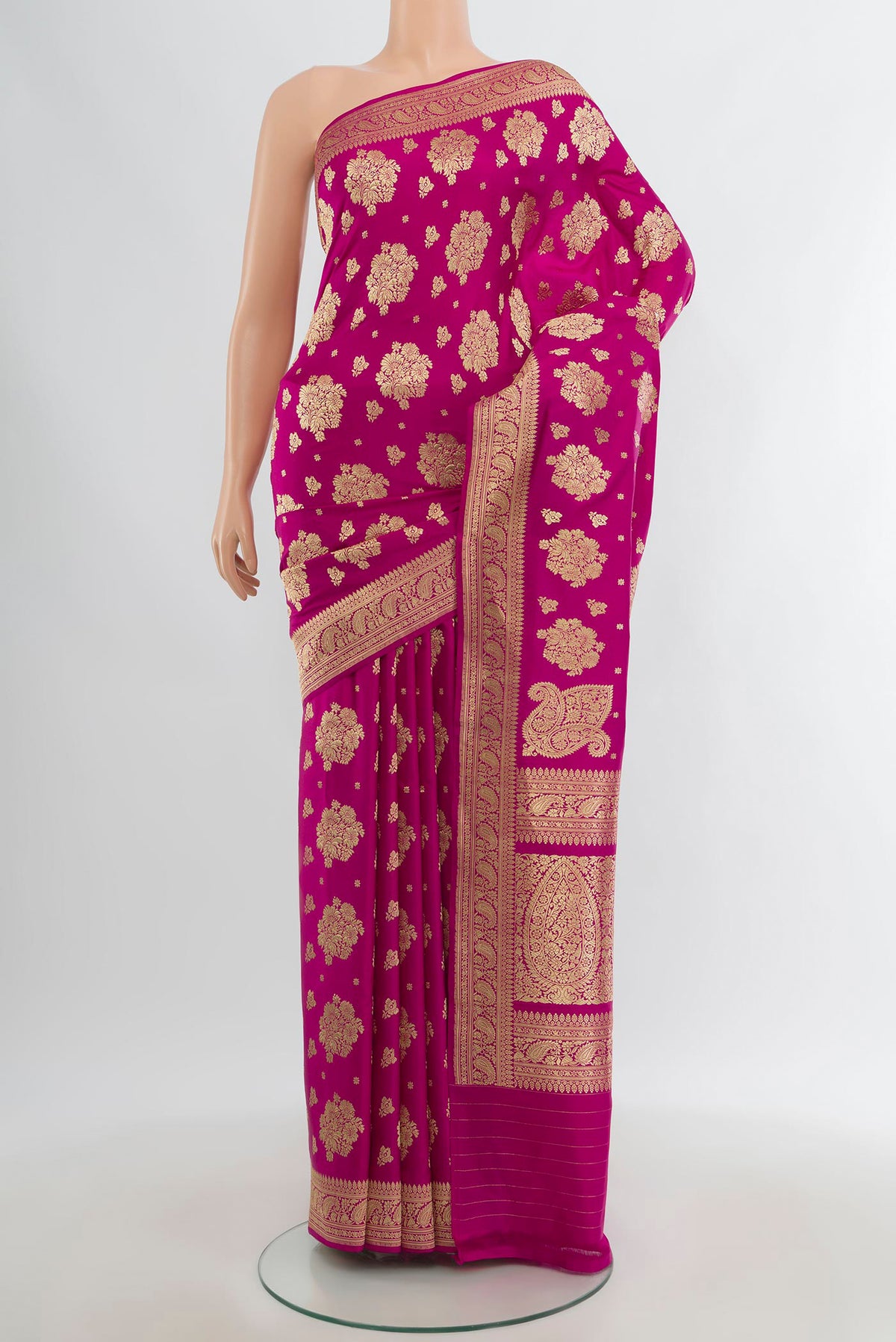 Pure Silk Pure Zari Rani Pink Banarasi Saree with Zari Butta on the body and Zari Border.  displayed on a mannequin