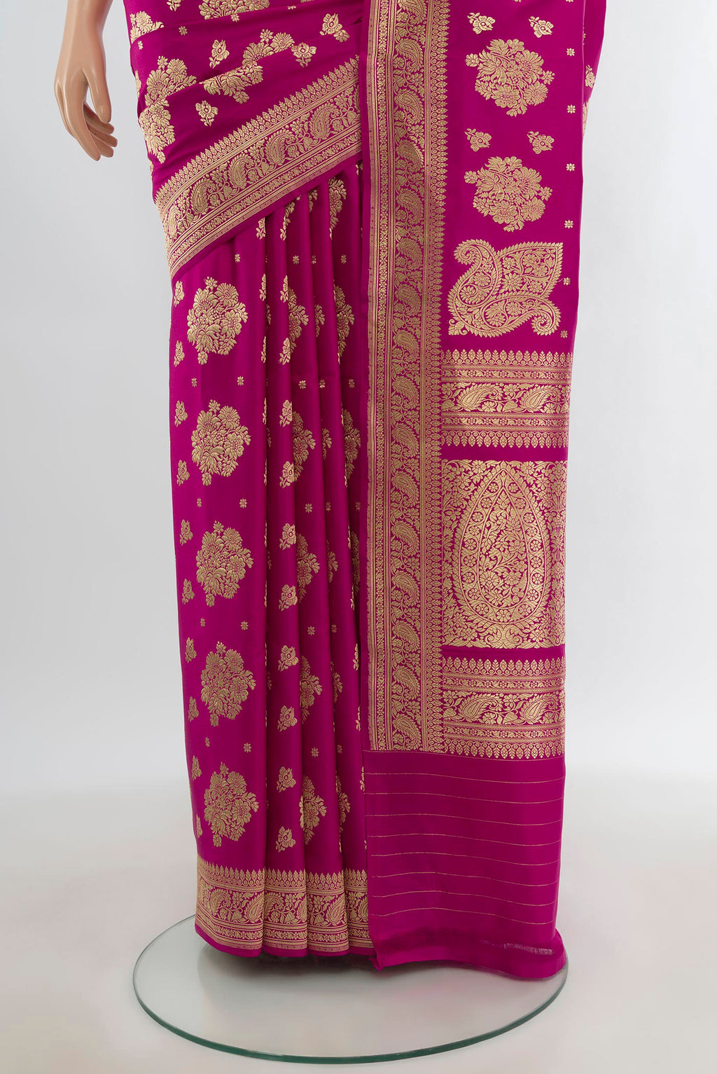 Pleats and pallu of Pure Silk Pure Zari Rani Pink Banarasi Saree with Zari Butta on the body and Zari Border. 