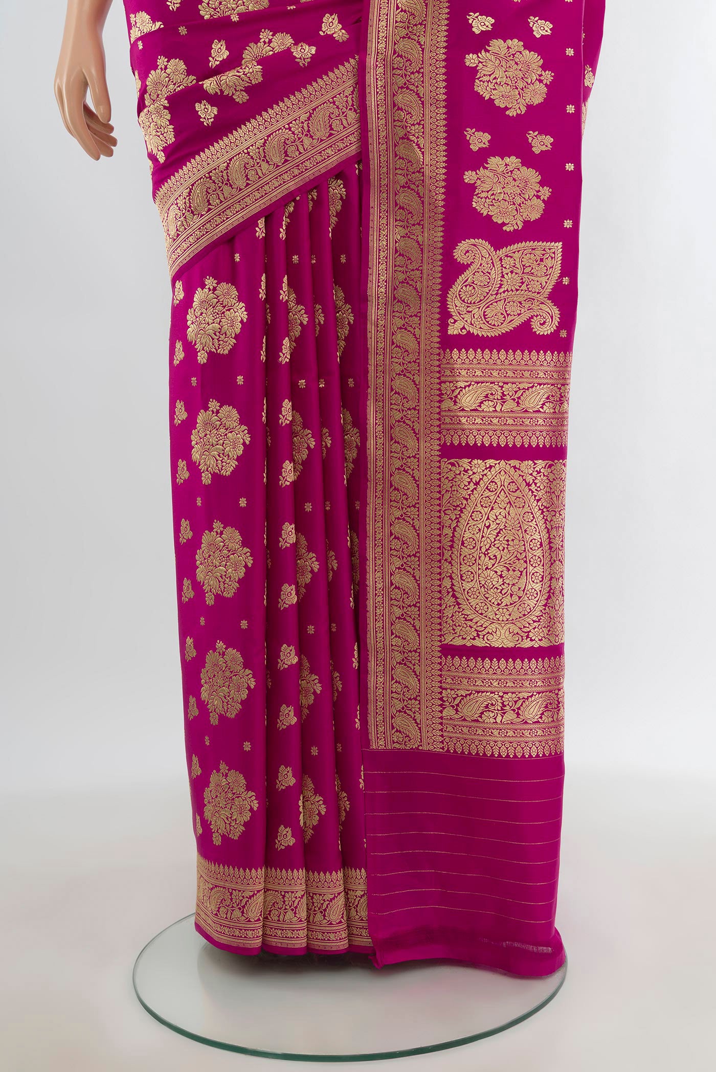 Pleats and pallu of Pure Silk Pure Zari Rani Pink Banarasi Saree with Zari Butta on the body and Zari Border. 