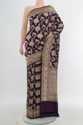 Pure Silk Pure Zari Navy Blue Banarasi Saree with Zari Butta on the body and Zari Border.  displayed on a mannequin