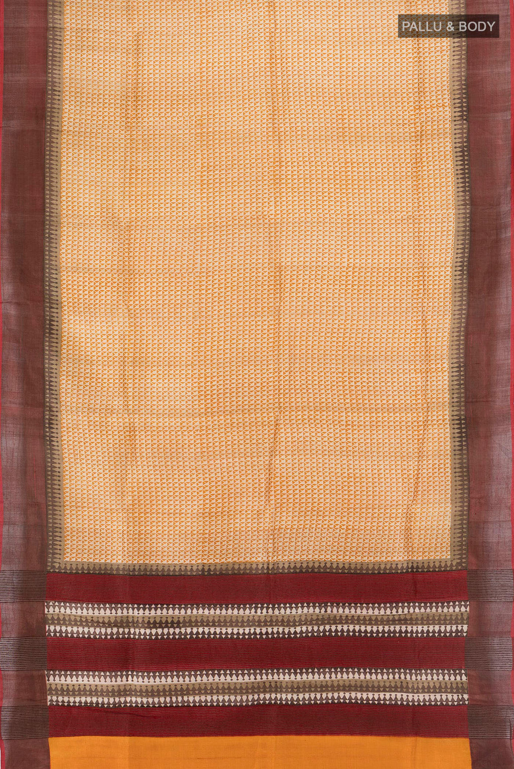 Flat view of Beige Tussar Silk Saree with Printed design on the body and Zari Border. 