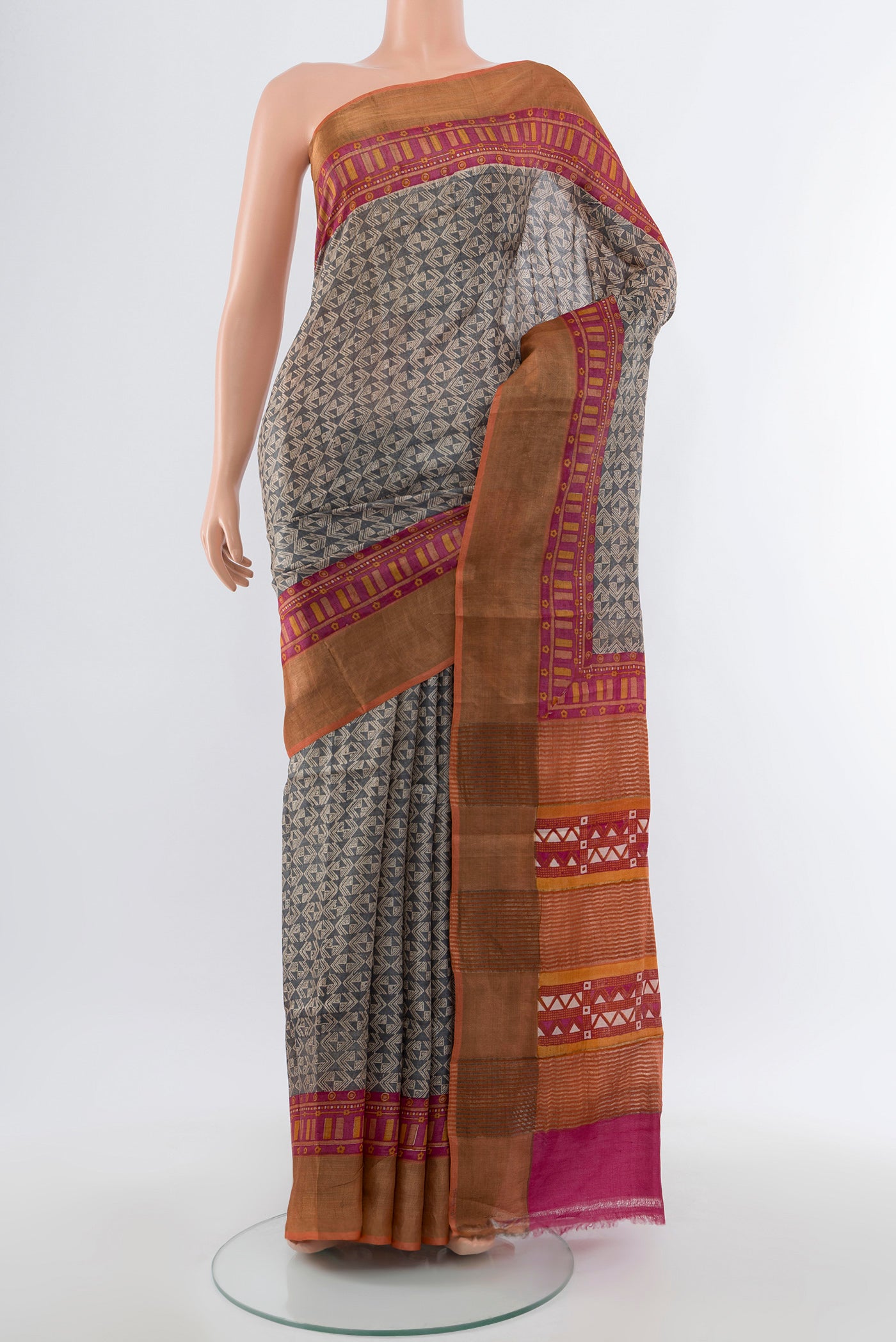 Multi Color Tussar Silk Saree with Floral Print on the body and Silk Border.  displayed on a mannequin