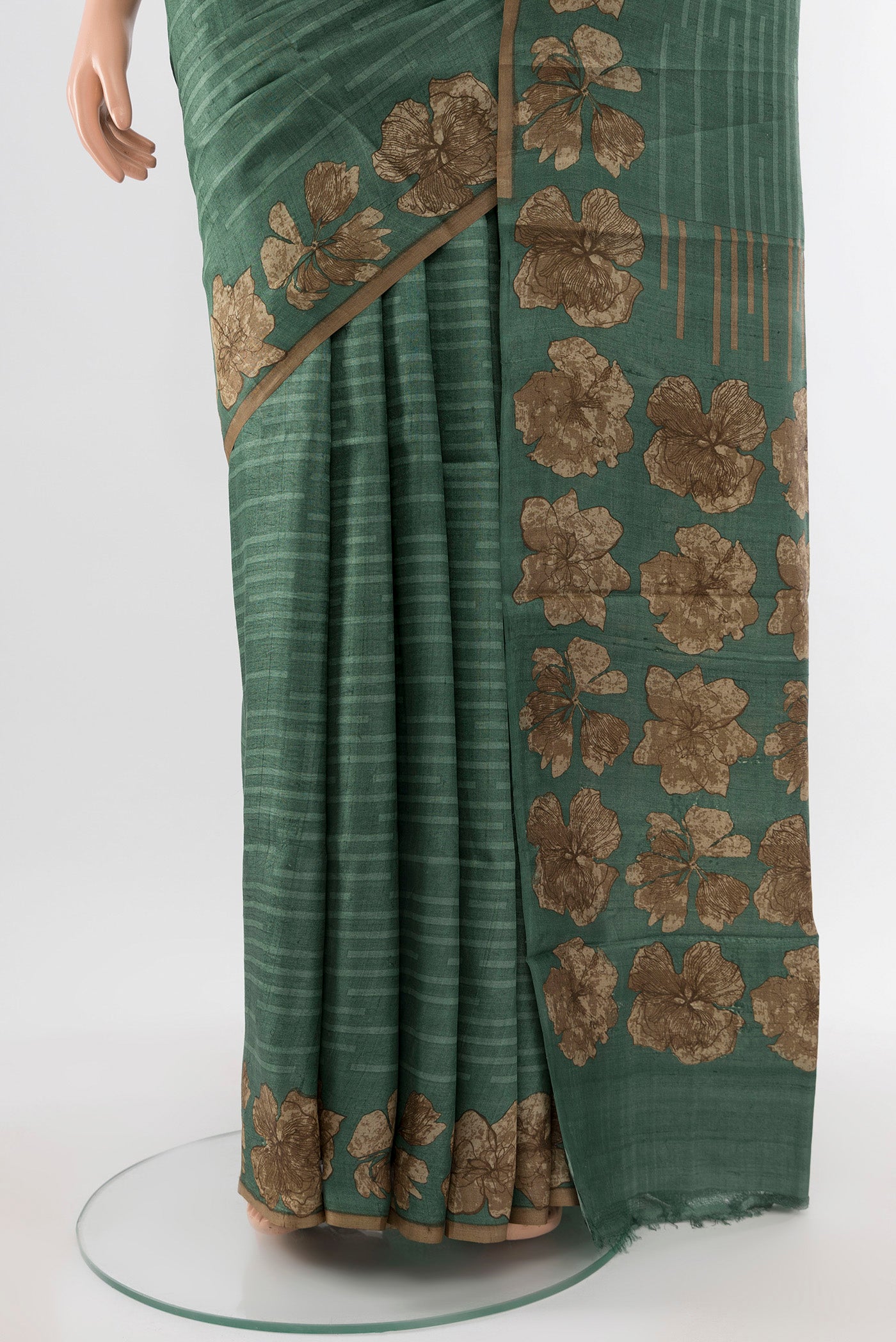 Pleats and pallu of Light Green Tussar Silk Saree with Floral Print on the body and Silk Border. 