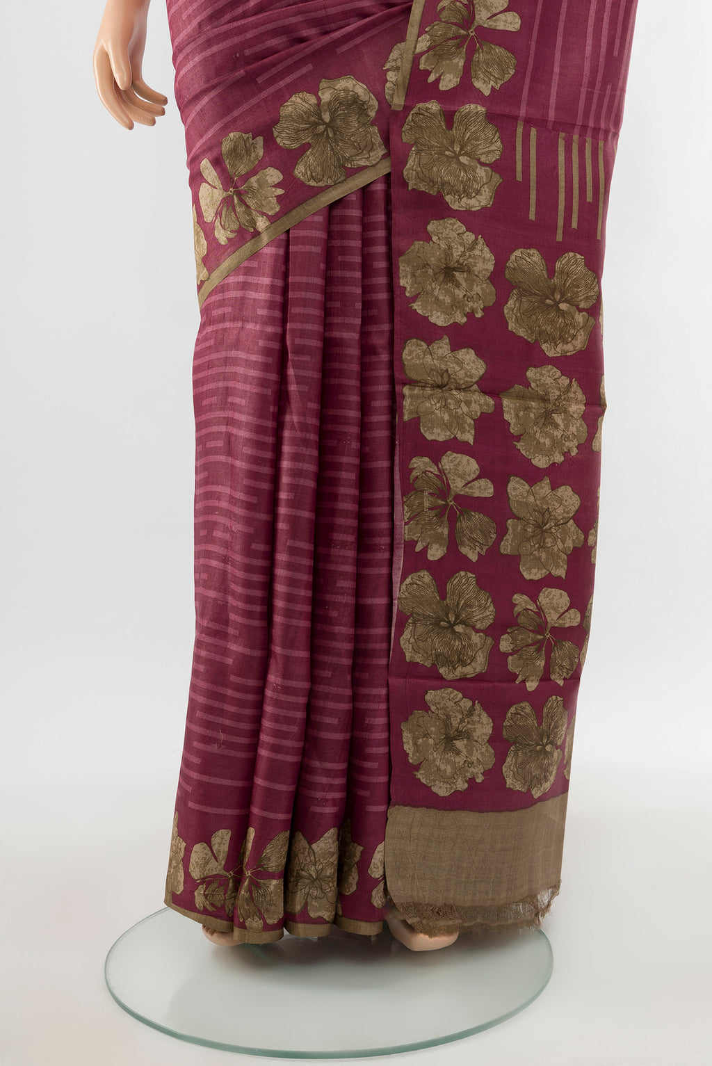 Pleats and pallu of Bronze Tussar Silk Saree with Floral Print on the body and Silk Border. 
