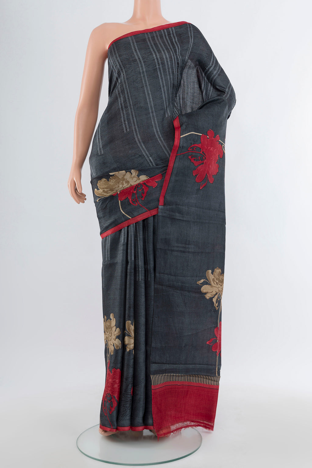 Multi Color Tussar Silk Saree with Floral Print on the body and Silk Border.  displayed on a mannequin