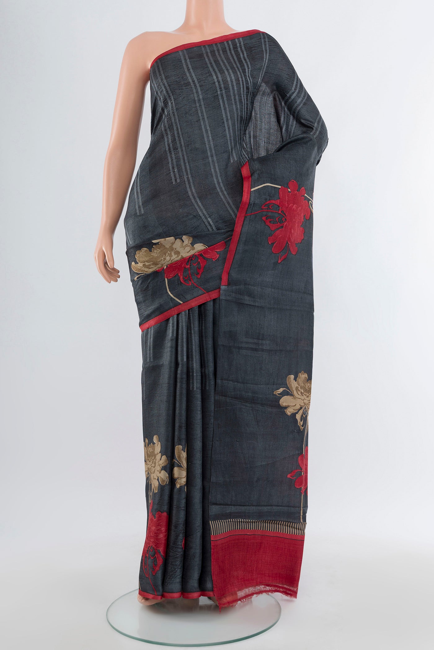 Multi Color Tussar Silk Saree with Floral Print on the body and Silk Border.  displayed on a mannequin