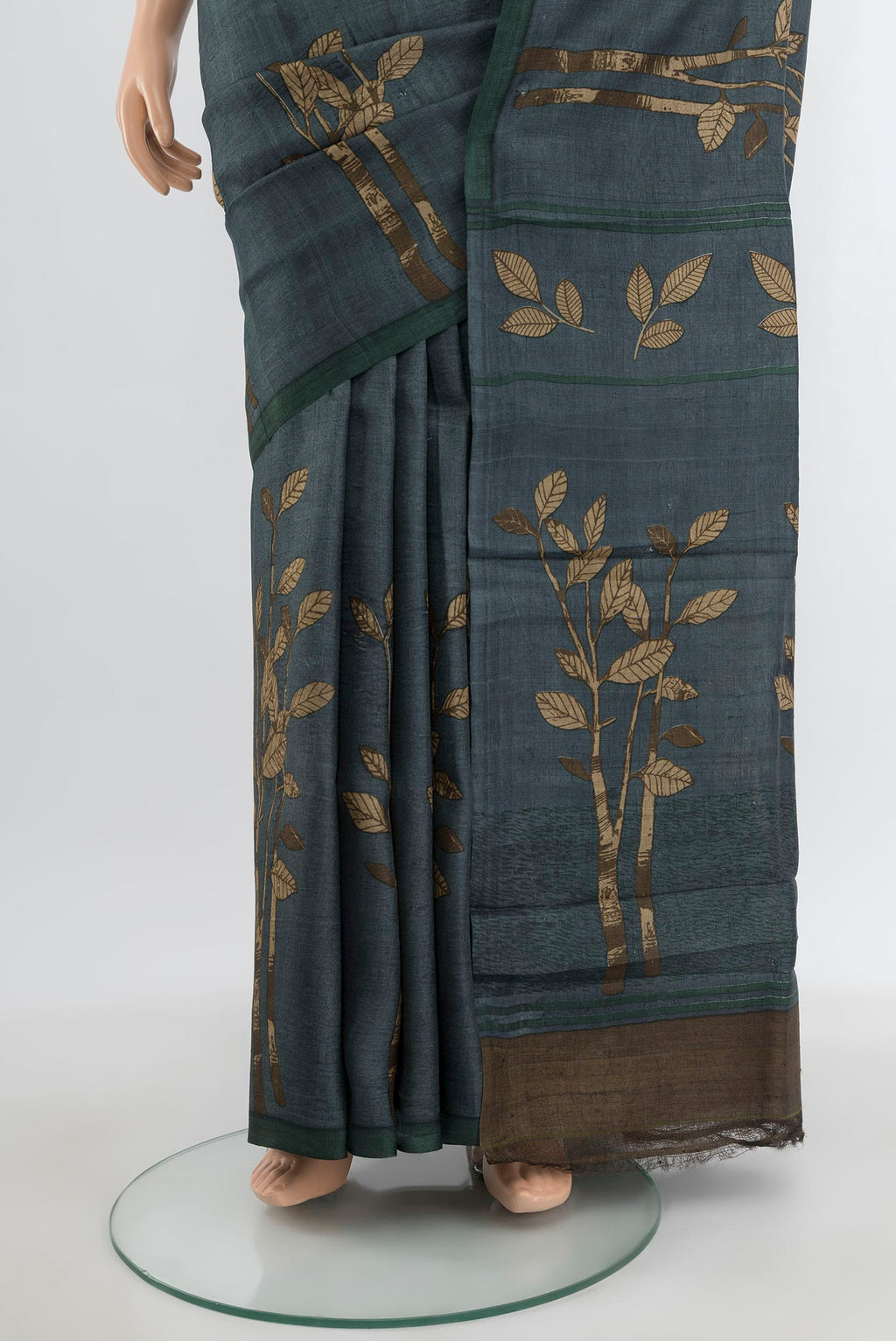 Pleats and pallu of Davys Grey Tussar Silk Saree with Floral Print on the body and Without Border. 