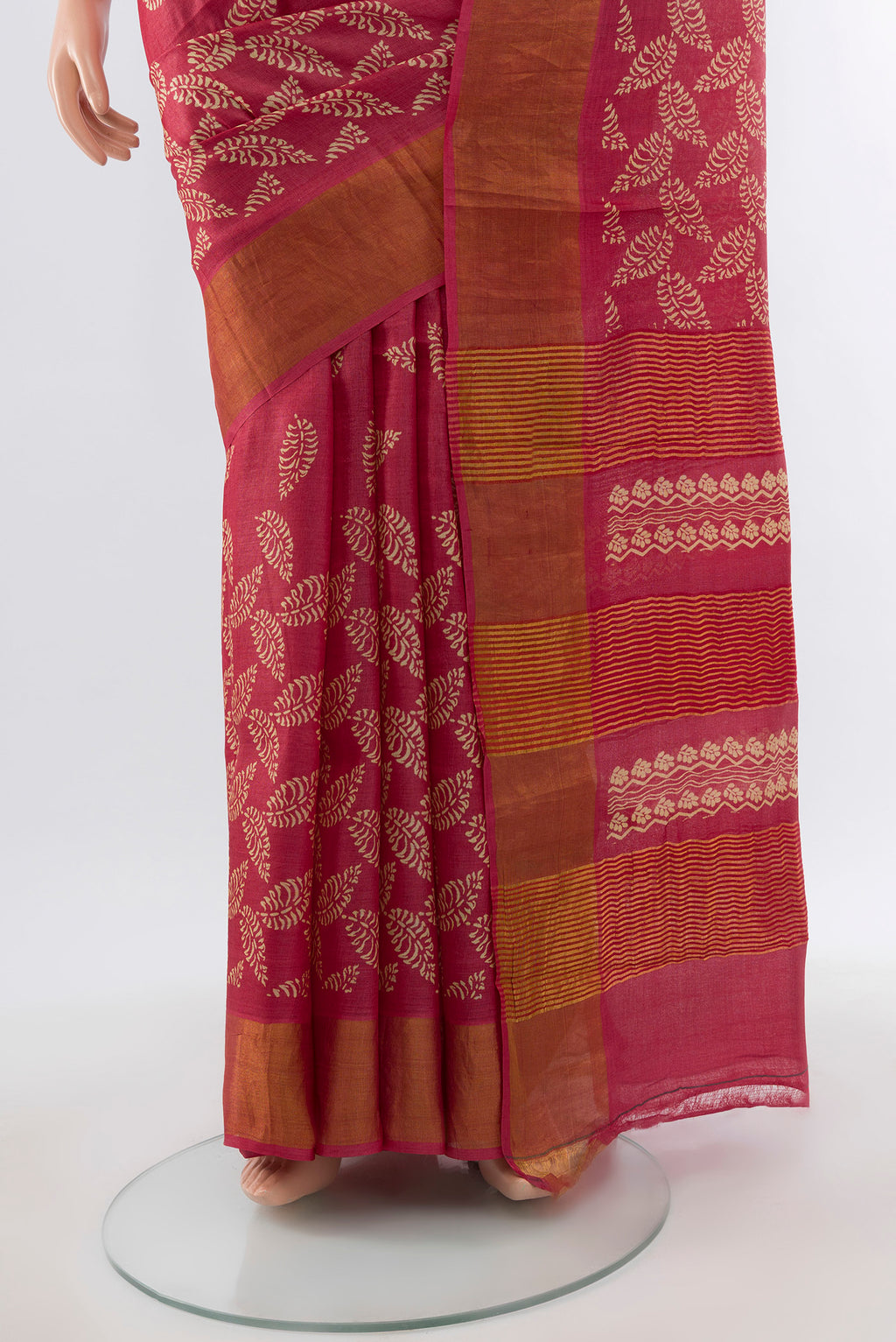 Pleats and pallu of Peach Tussar Silk Saree with Floral Print on the body and Silk Border. 