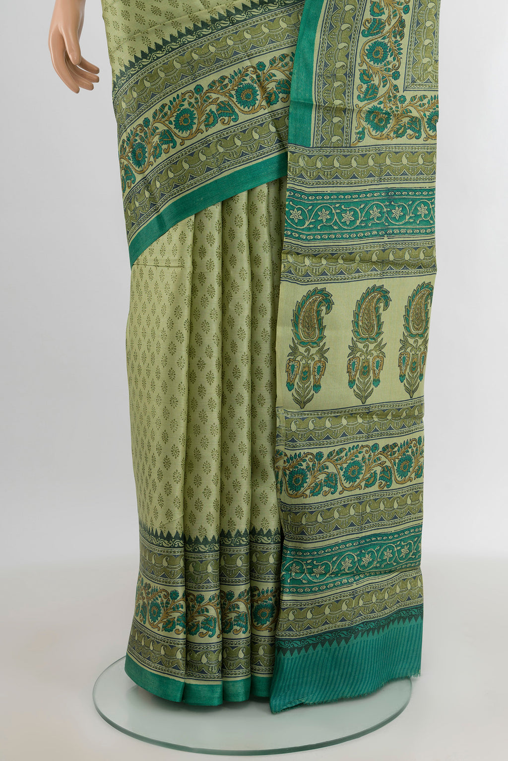 Pleats and pallu of Beige Tussar Silk Saree with Printed design on the body and Printed Border. 
