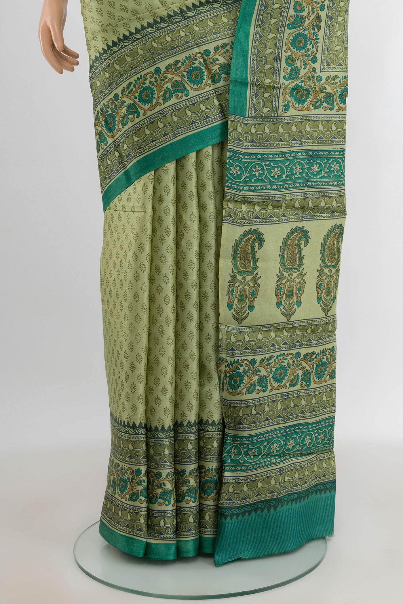 Pleats and pallu of Beige Tussar Silk Saree with Printed design on the body and Printed Border. 