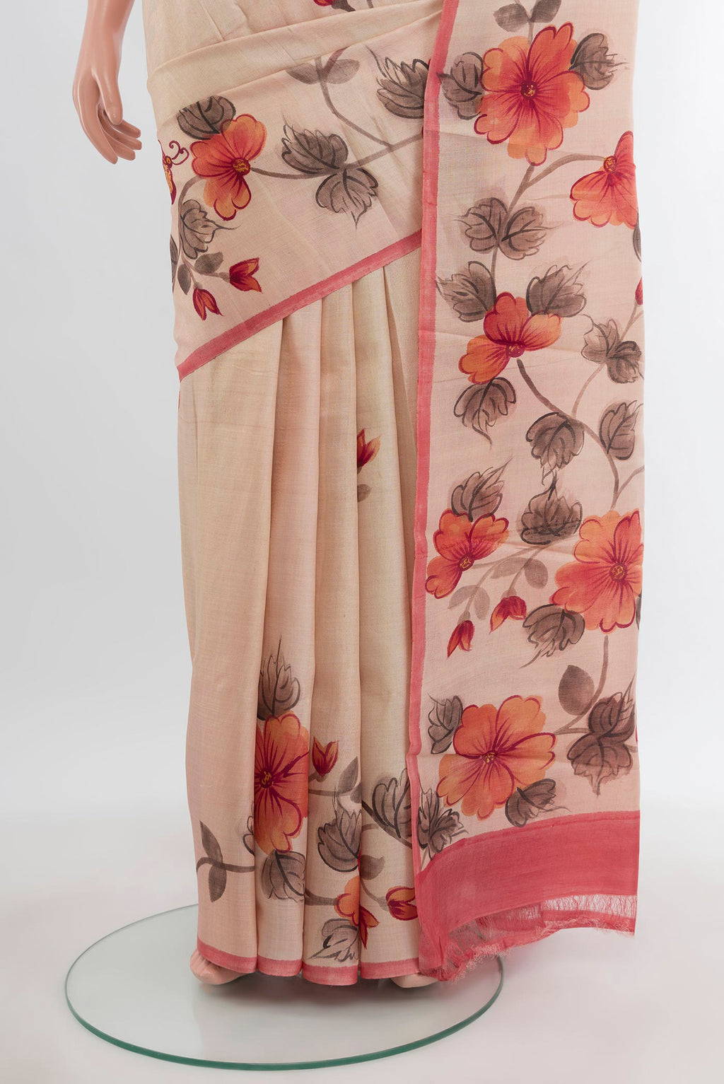 Pleats and pallu of Sandal Tussar Silk Saree with Floral Print on the body and Printed Border. 