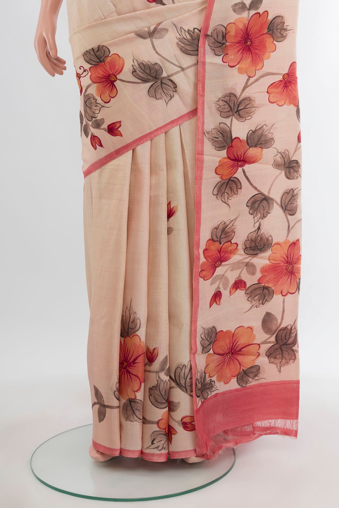 Pleats and pallu of Sandal Tussar Silk Saree with Floral Print on the body and Printed Border. 