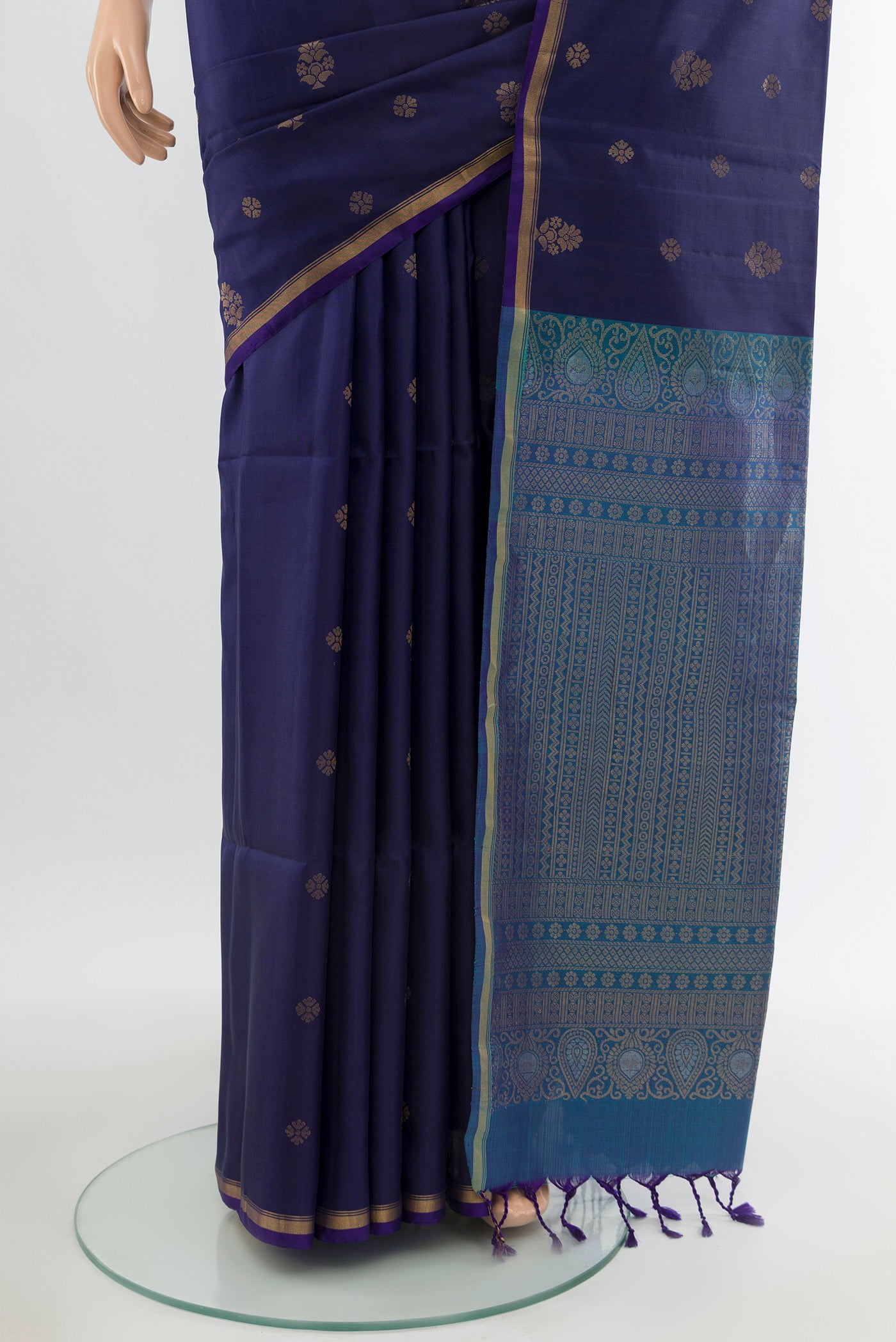 Pleats and pallu of Navy Blue Soft Silk Saree with Zari Butta on the body and Zari Border. 