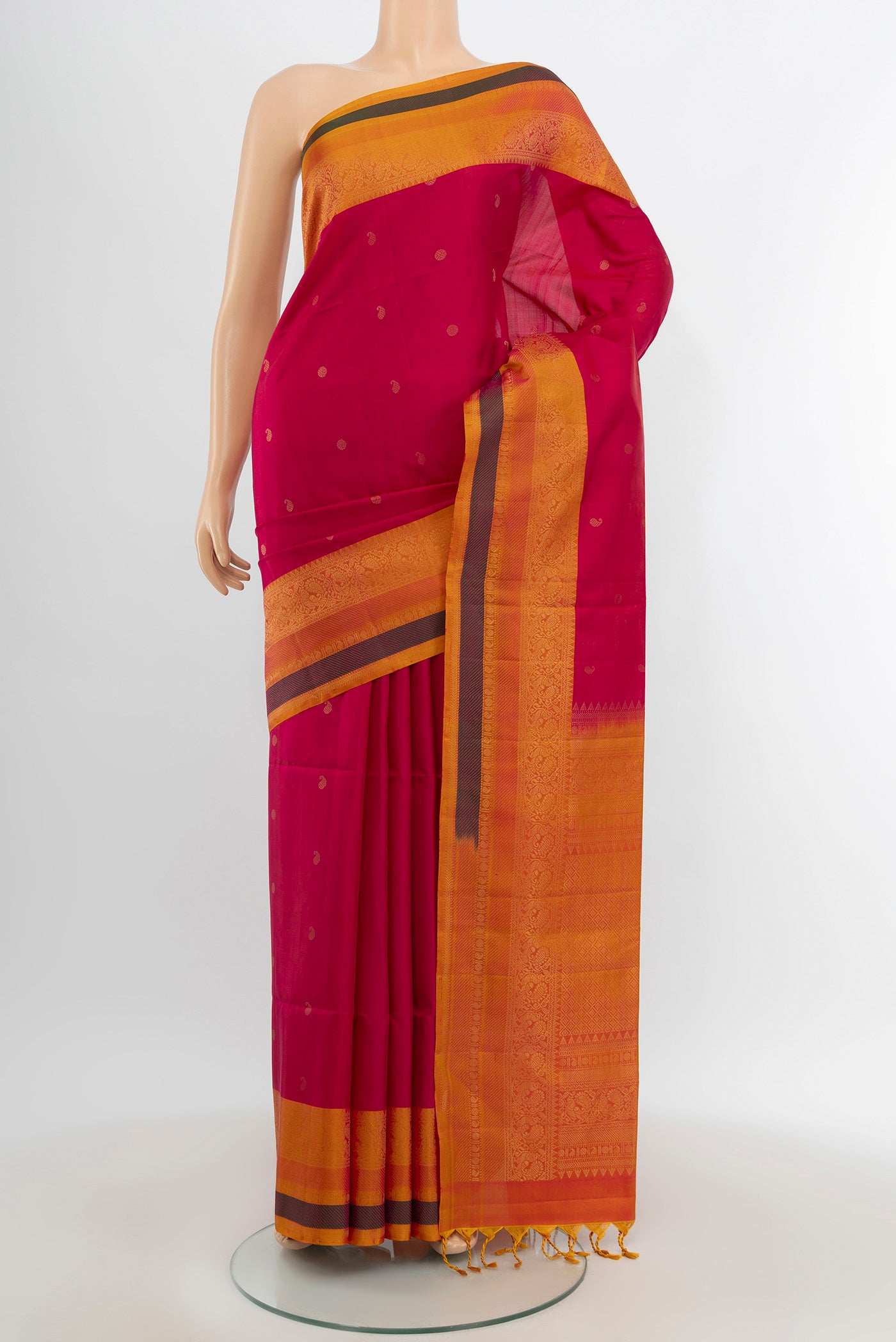 Dark Pink Soft Silk Saree with Zari Butta on the body and Zari Border.  displayed on a mannequin