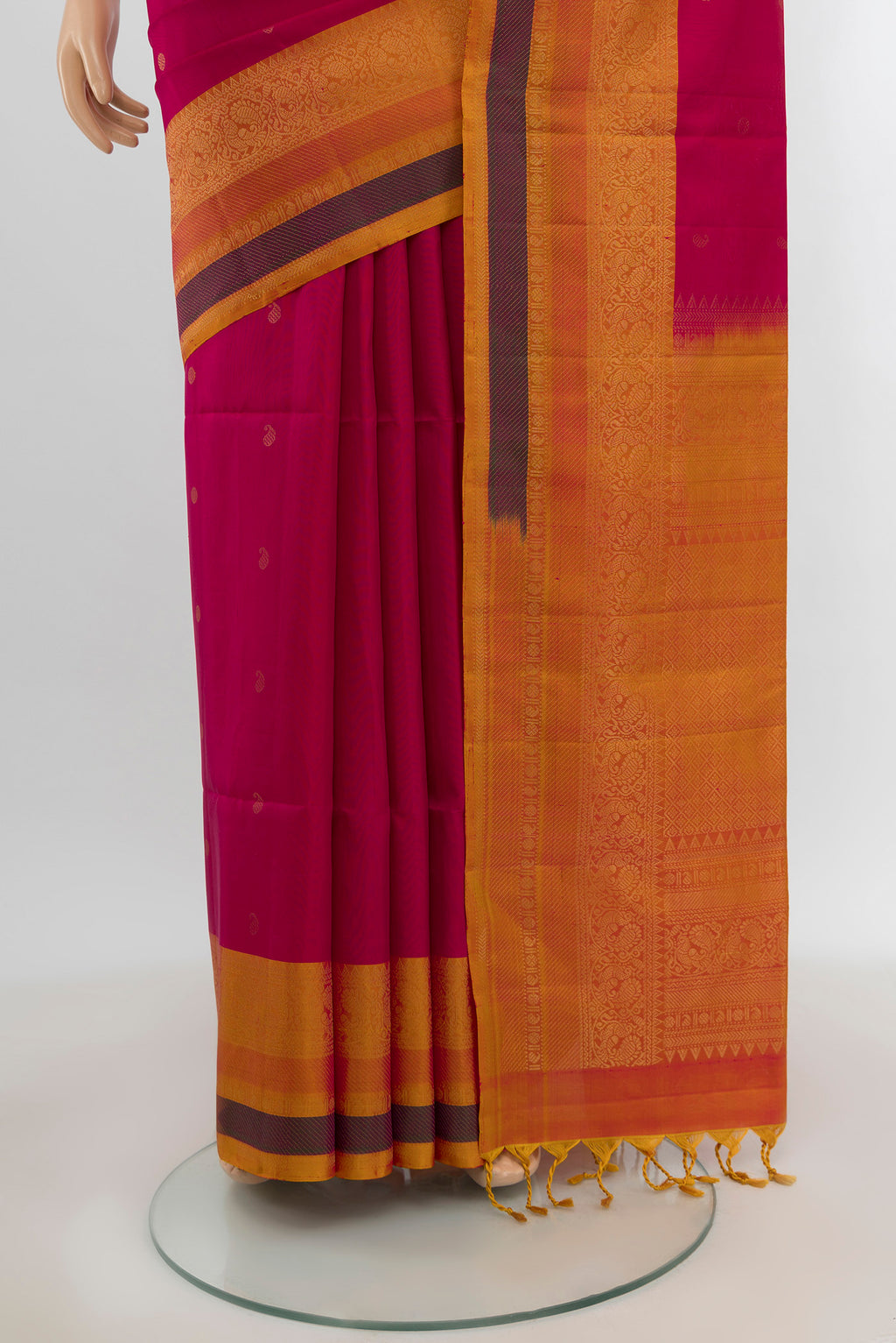 Pleats and pallu of Dark Pink Soft Silk Saree with Zari Butta on the body and Zari Border. 