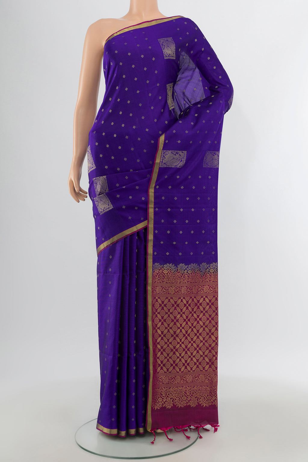 Dark Blue Soft Silk Saree with Zari Butta on the body and Zari Border.  displayed on a mannequin