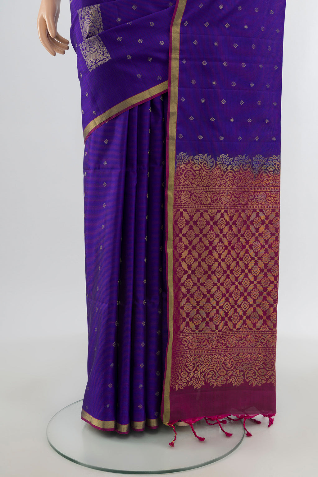 Pleats and pallu of Dark Blue Soft Silk Saree with Zari Butta on the body and Zari Border. 