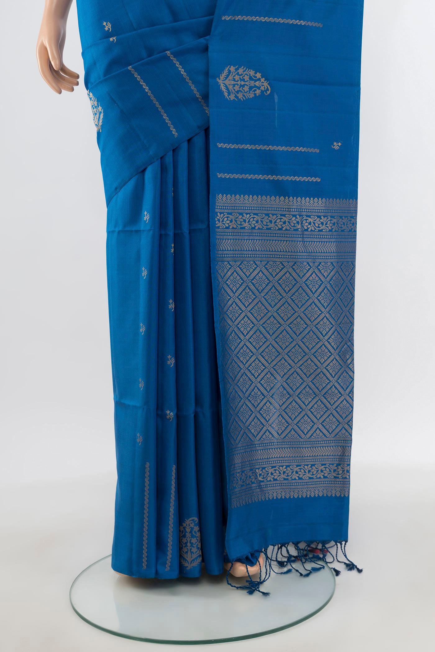 Pleats and pallu of Blue Soft Silk Saree with Zari Butta on the body and Without Border. 