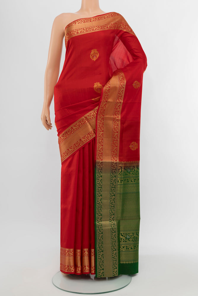 Red Soft Silk Saree with Zari Butta on the body and Silk Border.  displayed on a mannequin