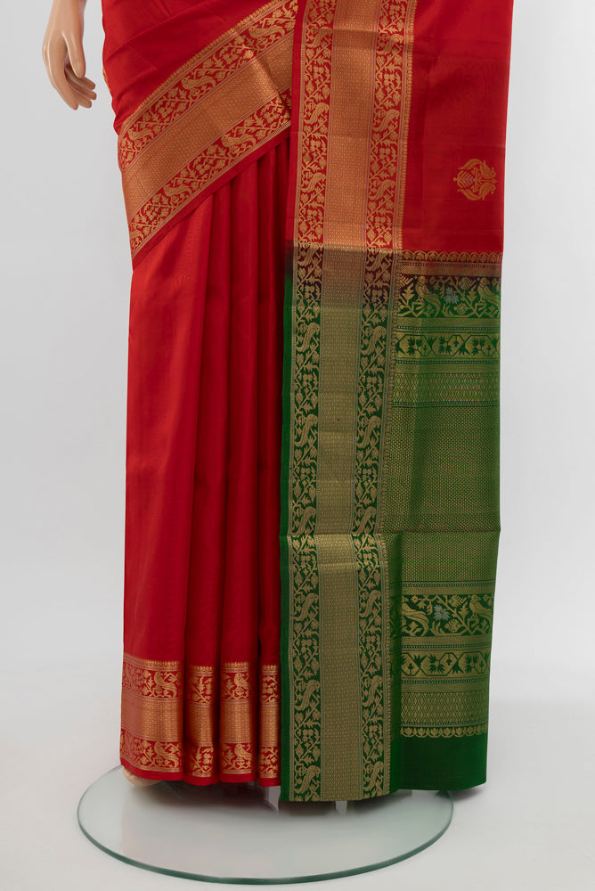 Pleats and pallu of Red Soft Silk Saree with Zari Butta on the body and Silk Border. 