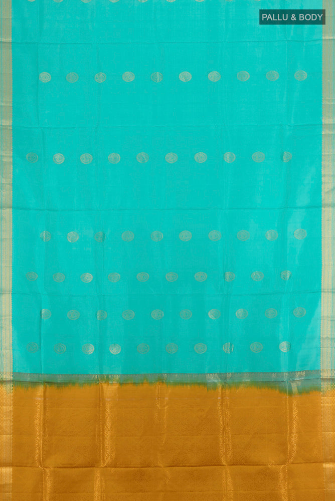 Flat view of Sky Blue Soft Silk Saree with Zari Butta on the body and Silk Border. 