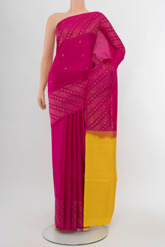 Magenta Soft Silk Saree with Zari Butta on the body and Silk Border.  displayed on a mannequin