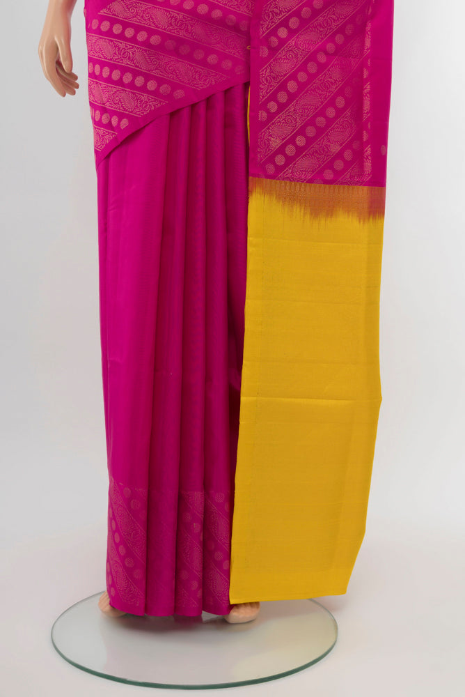 Pleats and pallu of Magenta Soft Silk Saree with Zari Butta on the body and Silk Border. 