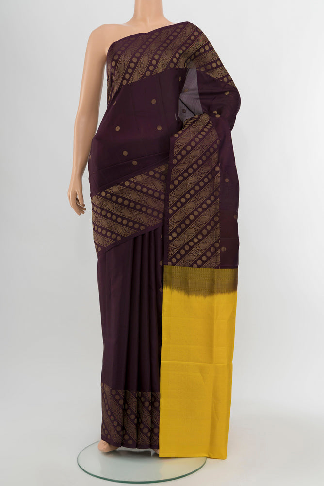 Coffee Brown Soft Silk Saree with Zari Butta on the body and Silk Border.  displayed on a mannequin