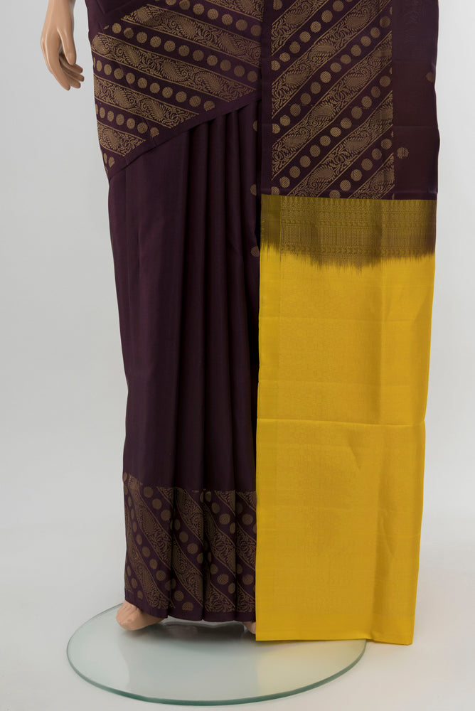 Pleats and pallu of Coffee Brown Soft Silk Saree with Zari Butta on the body and Silk Border. 