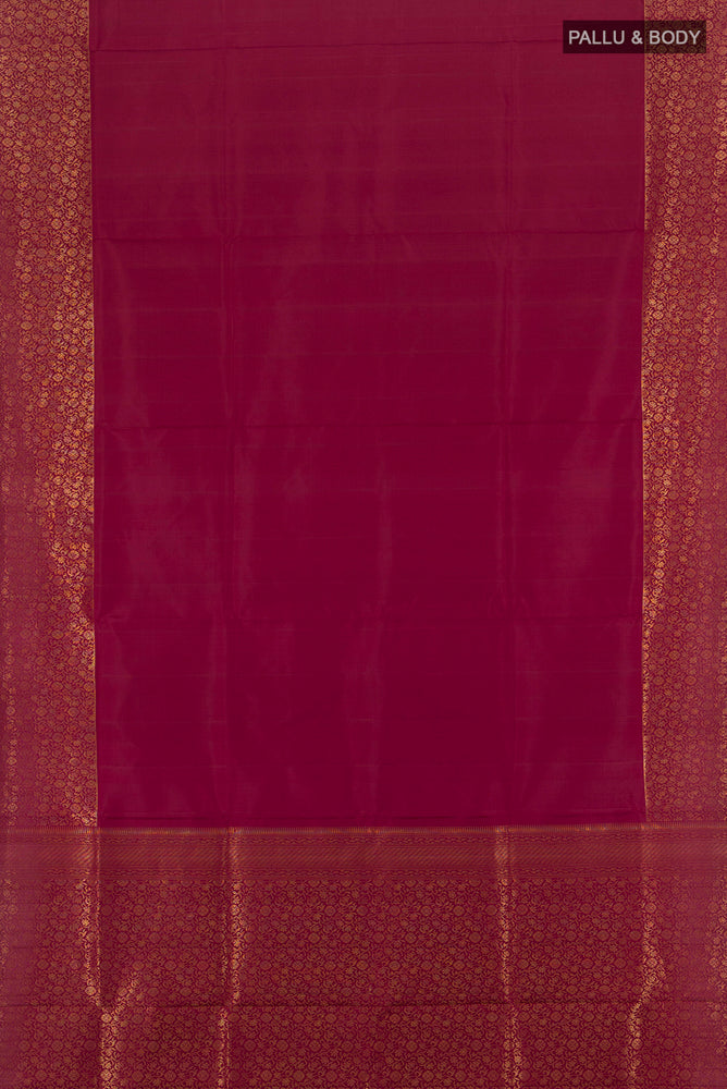 Flat view of Maroon Soft Silk Saree with Zari Butta on the body and Silk Border. 