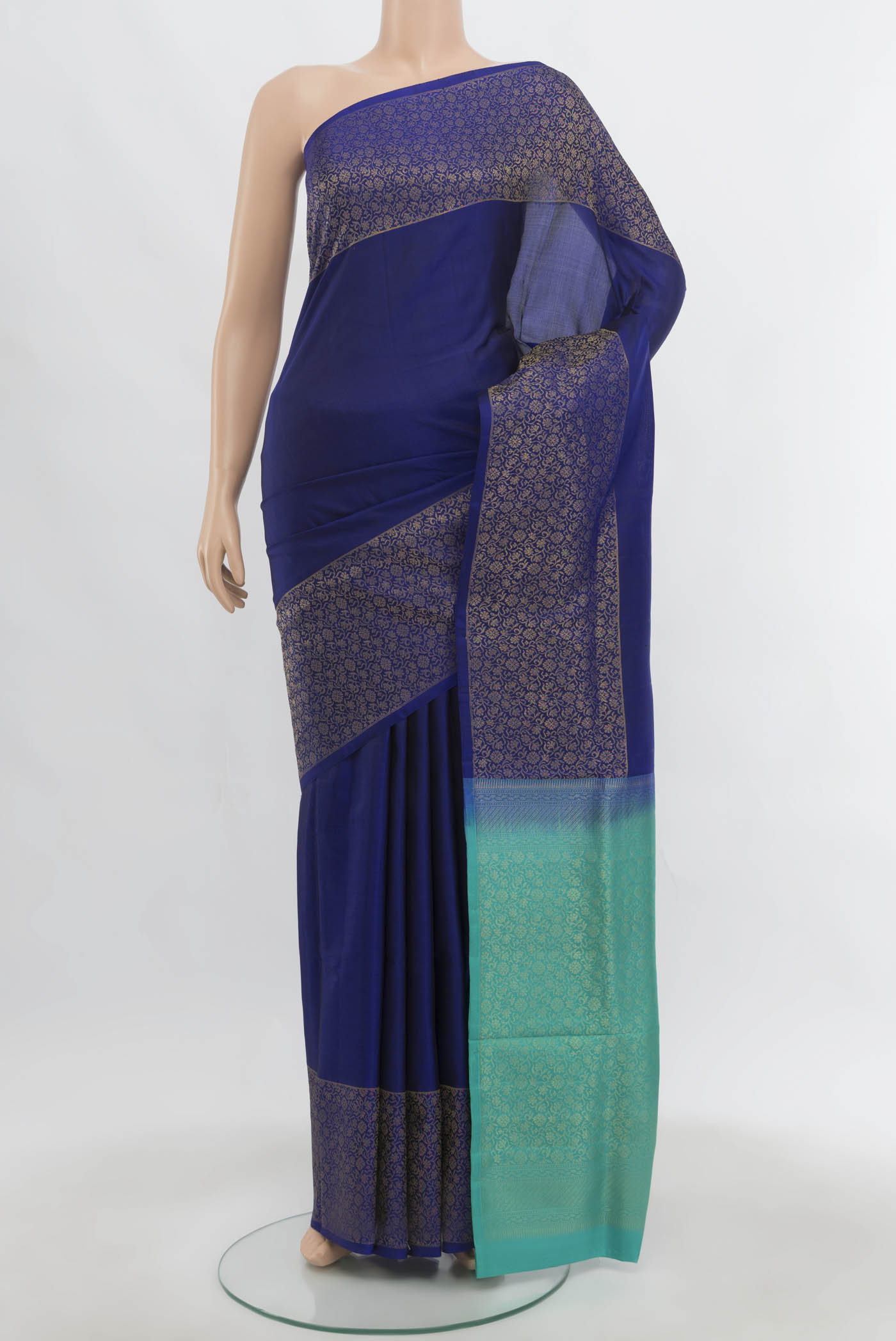Navy Blue Soft Silk Saree with Zari Butta on the body and Zari Border.  displayed on a mannequin