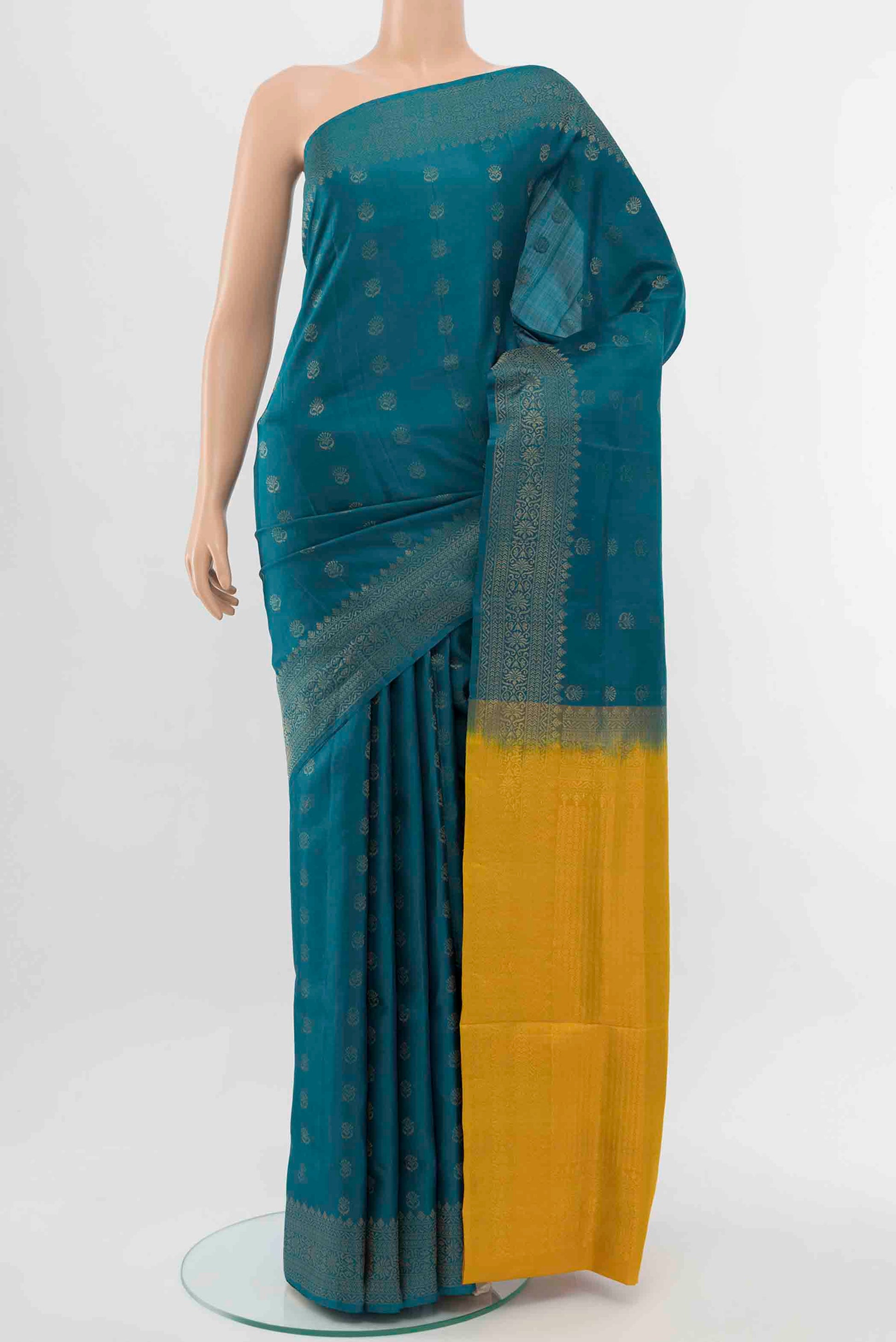 Light Blue Soft Silk Saree with Zari Butta on the body and Zari Border displayed on a mannequin