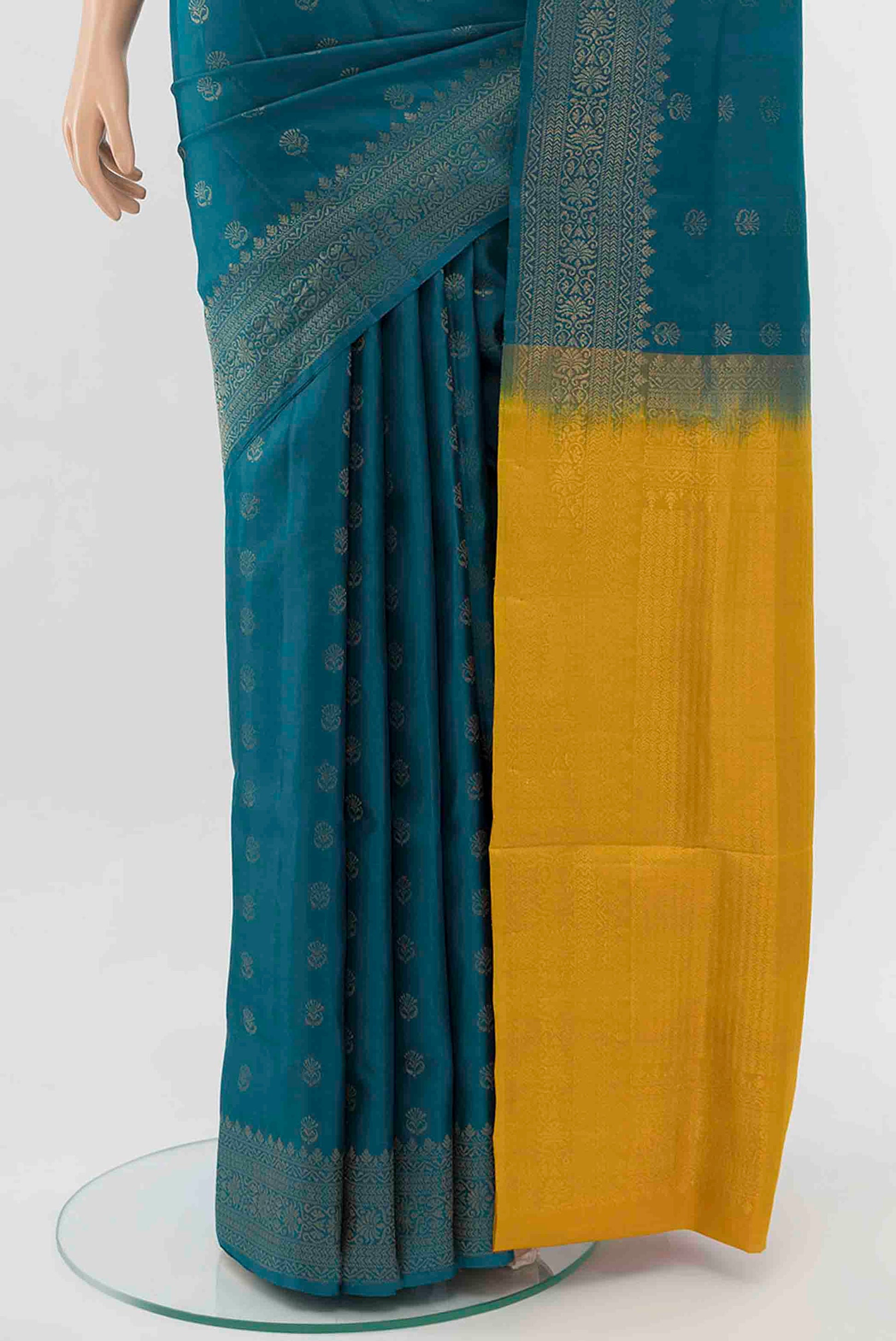 Pleats and pallu of Light Blue Soft Silk Saree with Zari Butta on the body and Zari Border
