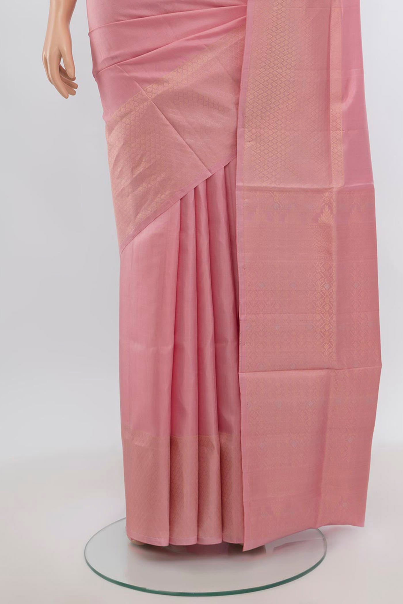 Pleats and pallu of Rose pink Soft Silk Saree with Zari Butta on the body and Zari Border. 