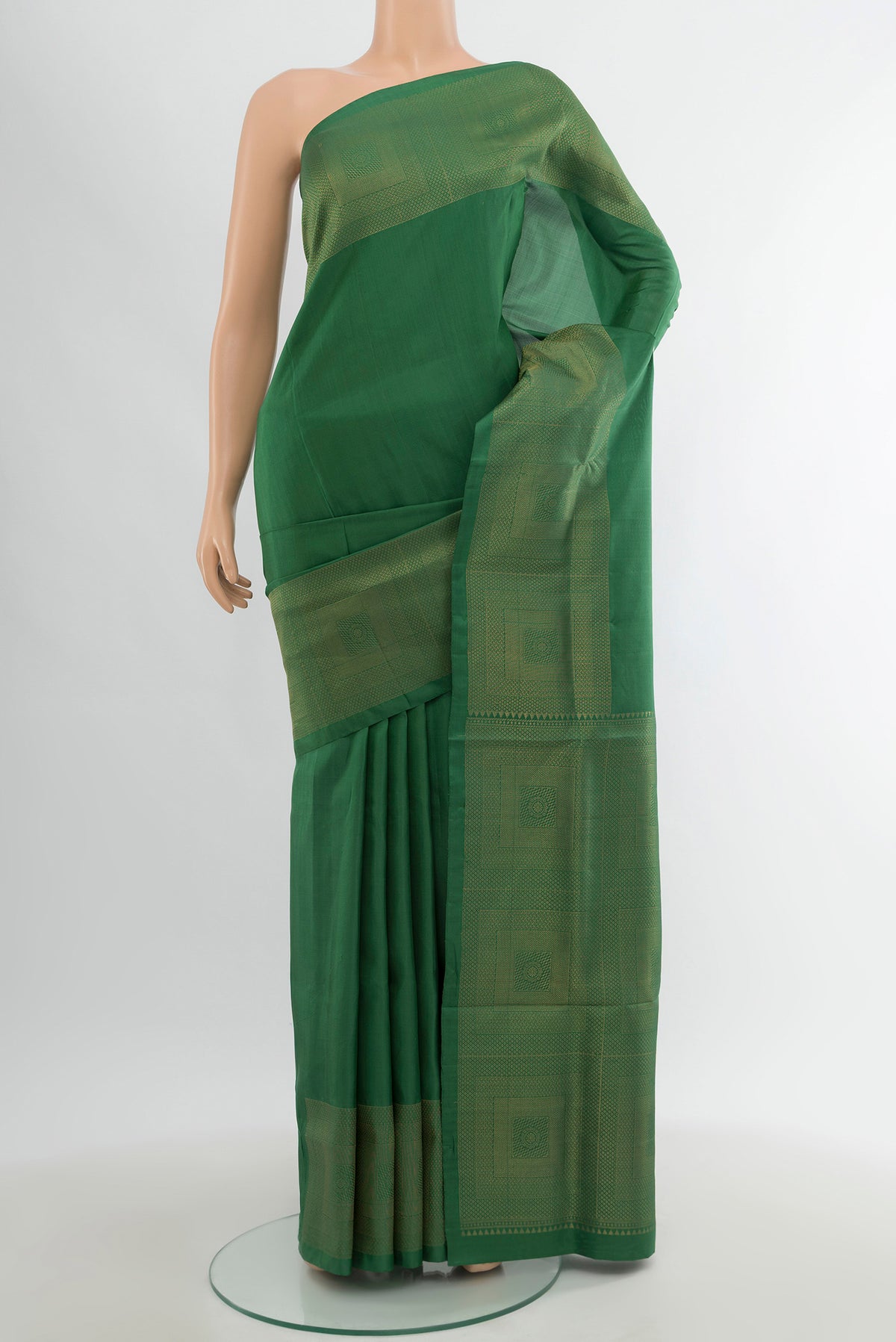 Green Soft Silk Saree with Plain Body and Zari Border.  displayed on a mannequin