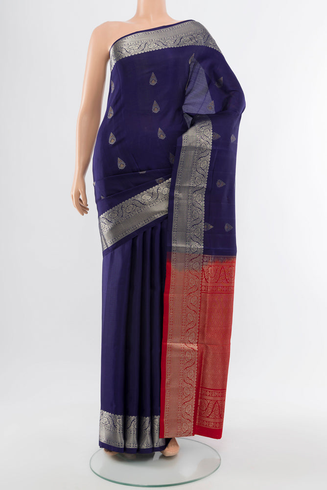 Navy Blue Soft Silk Saree with Zari Butta on the body and Silk Border.  displayed on a mannequin