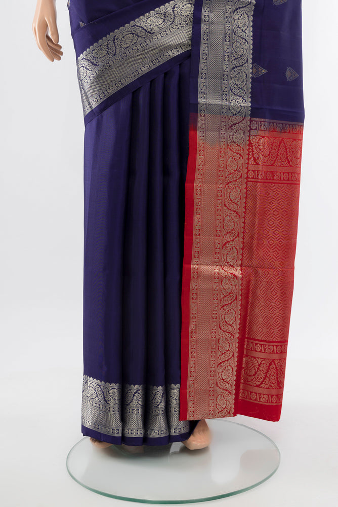Pleats and pallu of Navy Blue Soft Silk Saree with Zari Butta on the body and Silk Border. 