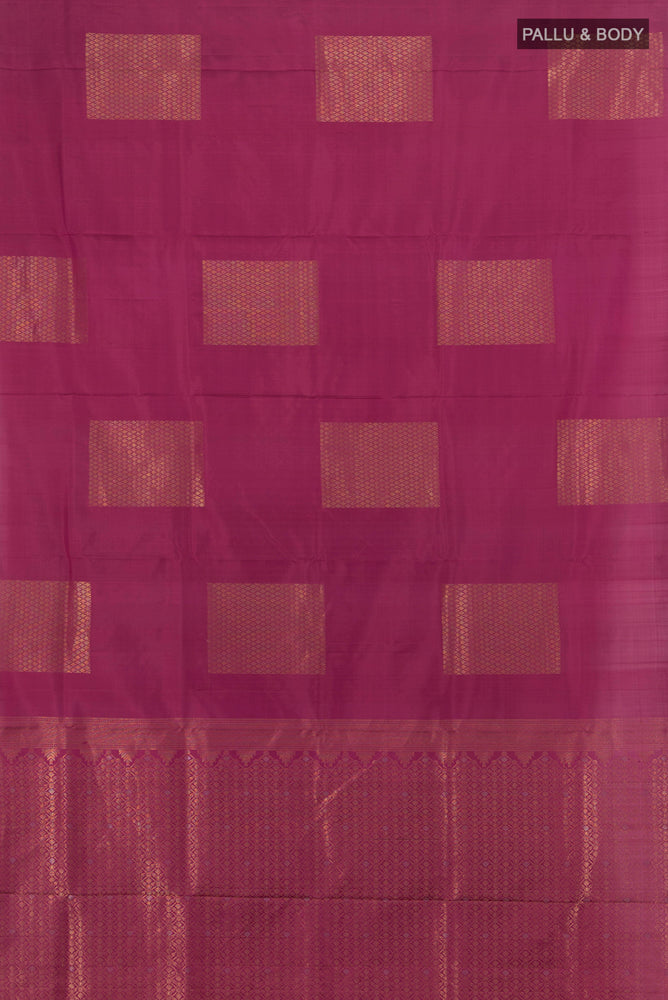 Flat view of Bronze Soft Silk Saree with Zari Butta on the body and Silk Border. 