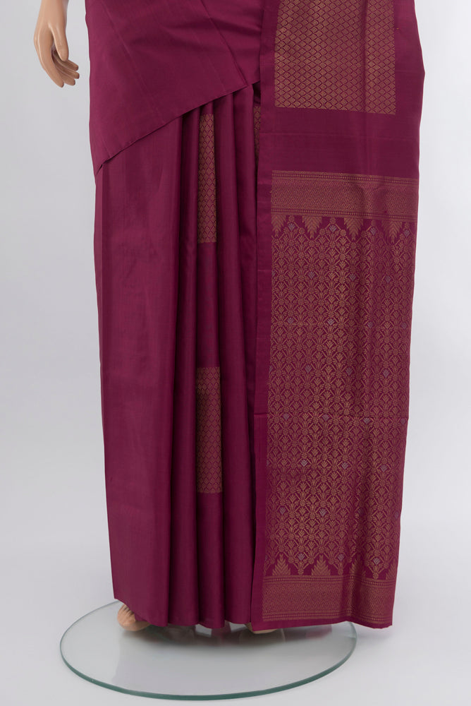Pleats and pallu of Bronze Soft Silk Saree with Zari Butta on the body and Silk Border. 