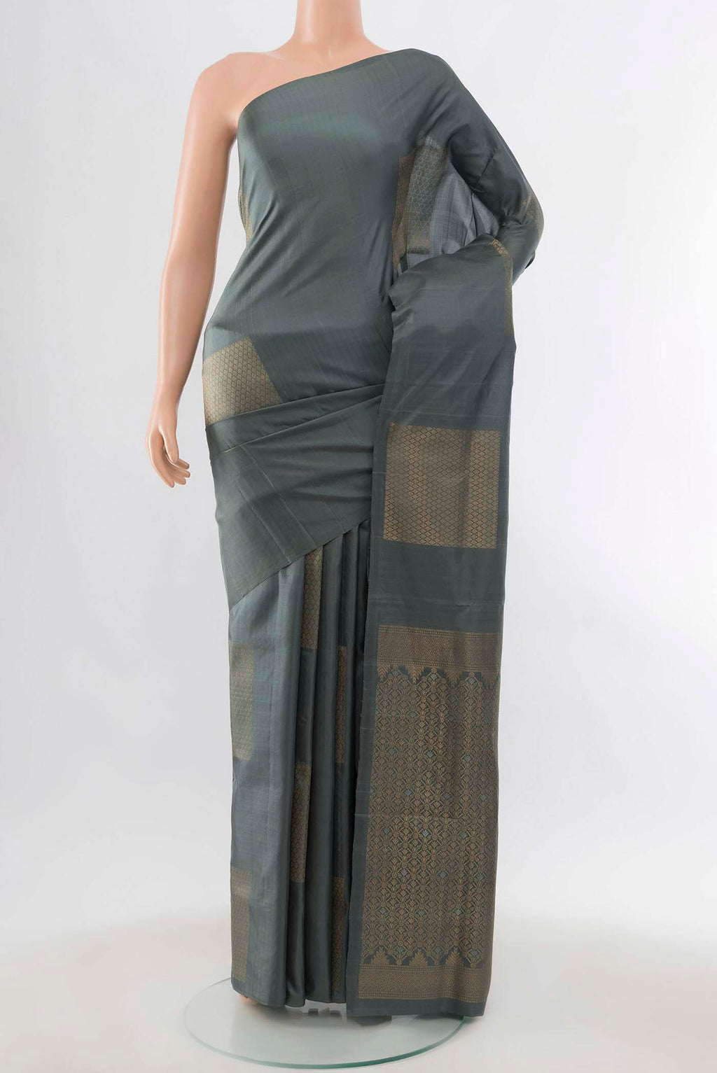 Grey Soft Silk Saree with Zari Butta on the body and Zari Border displayed on a mannequin