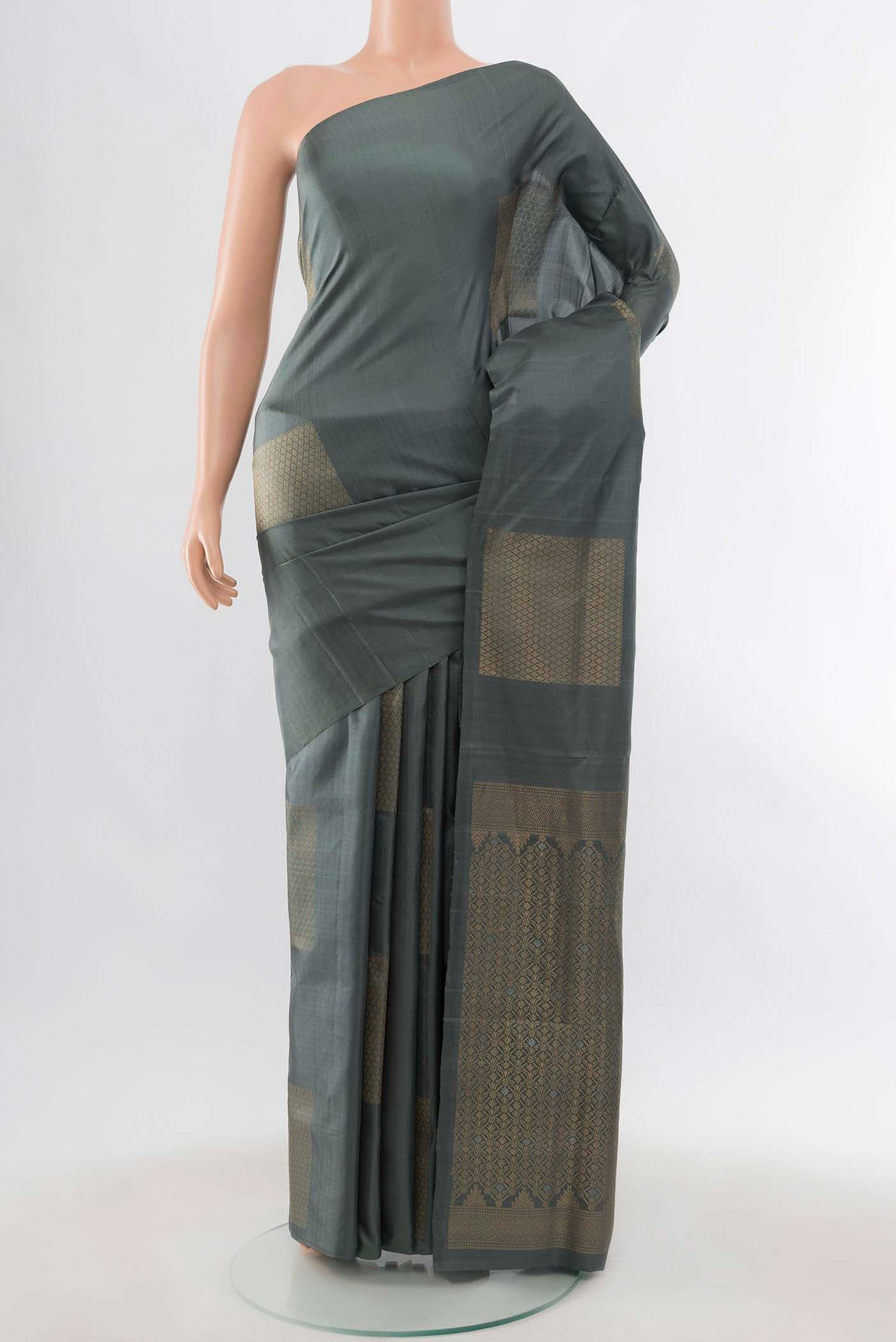 Grey Soft Silk Saree with Zari Butta on the body and Zari Border displayed on a mannequin
